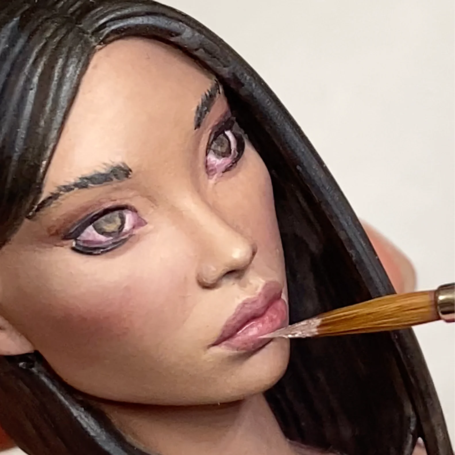 Close-up photo of a miniature being painted, made for Miniature Painting Glossary by Minichix Studio